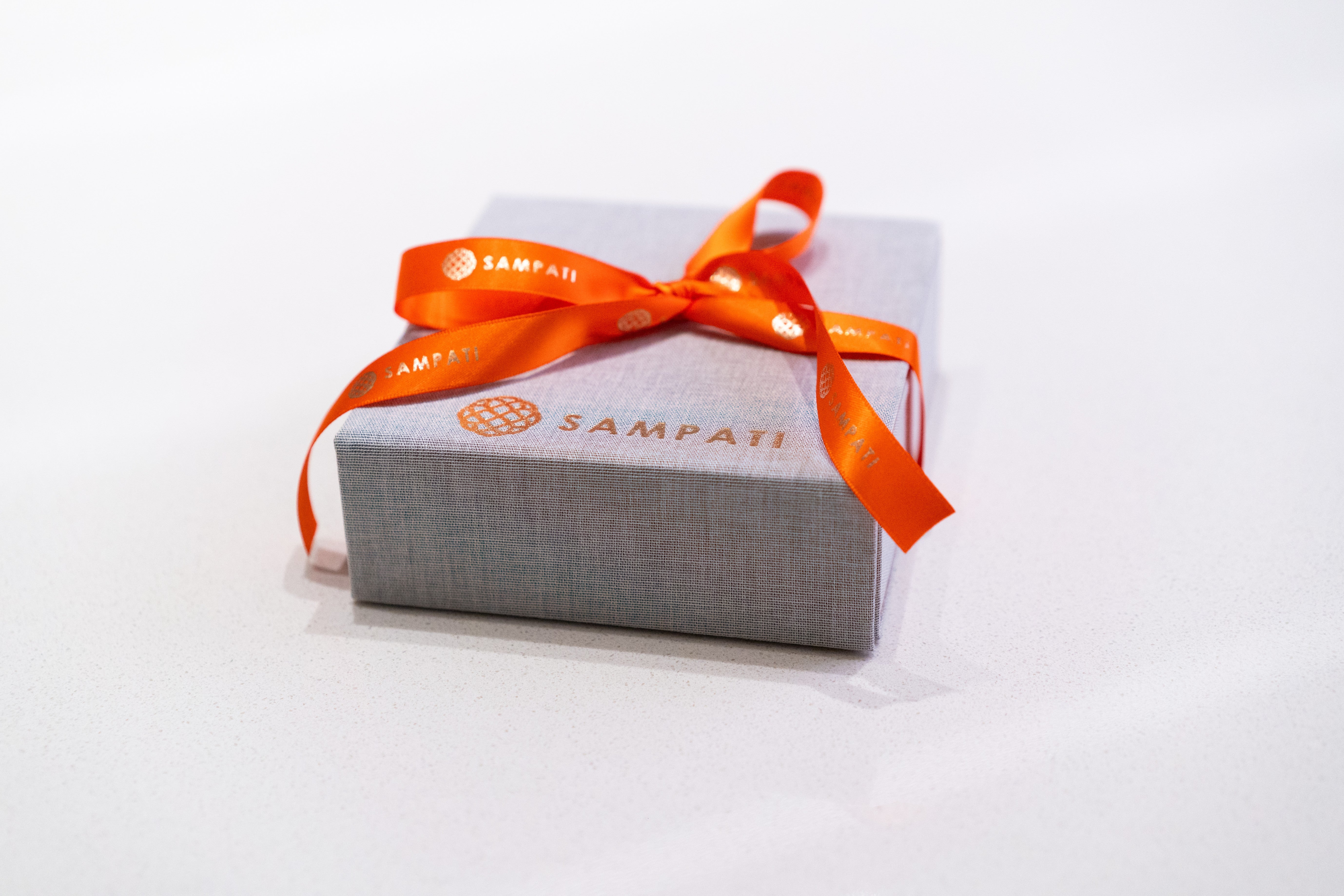 Gift box with orange ribbon