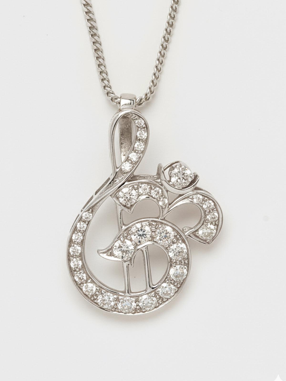 Om diamond pendant in white gold 